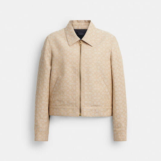 Image of a model wearing Outerwear. Productname: Signature Zip Jacket in LIGHT KHAKI colour by brand - Coach Outlet Australia