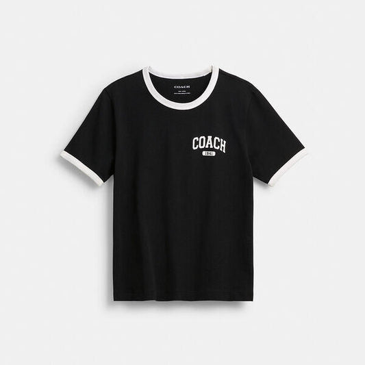 Image of a model wearing Tops. Productname: Sporty Signature Classic 70'S T-Shirt In Organic Cotton in BLACK colour by brand - Coach Outlet Australia