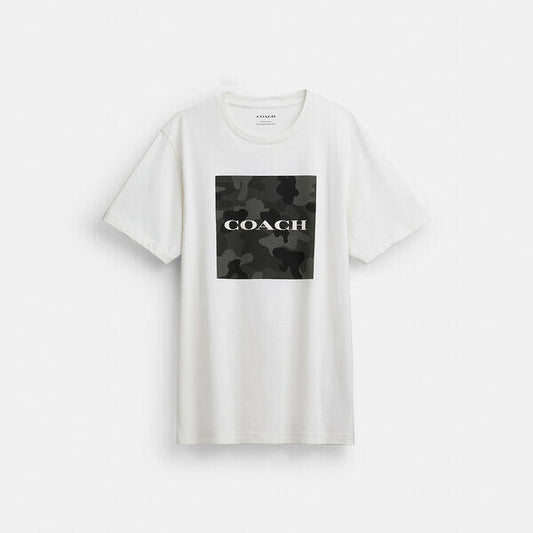 Image of a model wearing Tops. Productname: Camo Classic T-Shirt In Organic Cotton in VINTAGE IVORY colour by brand - Coach Outlet Australia