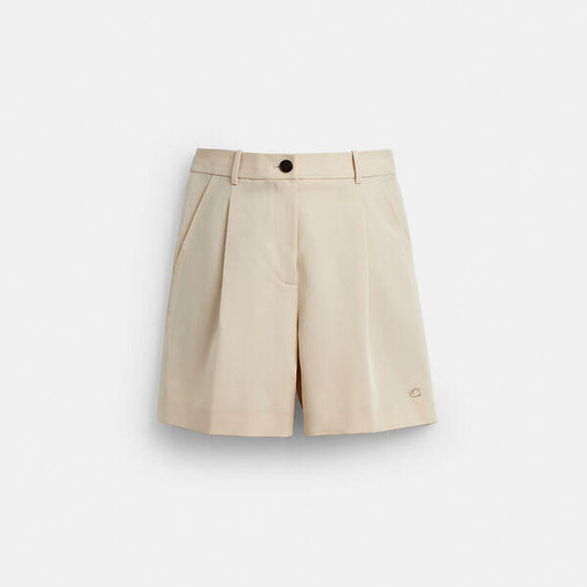 Image of a model wearing Shorts. Productname: Tailored Shorts In Recycled Polyester in SAND colour by brand - Coach Outlet Australia