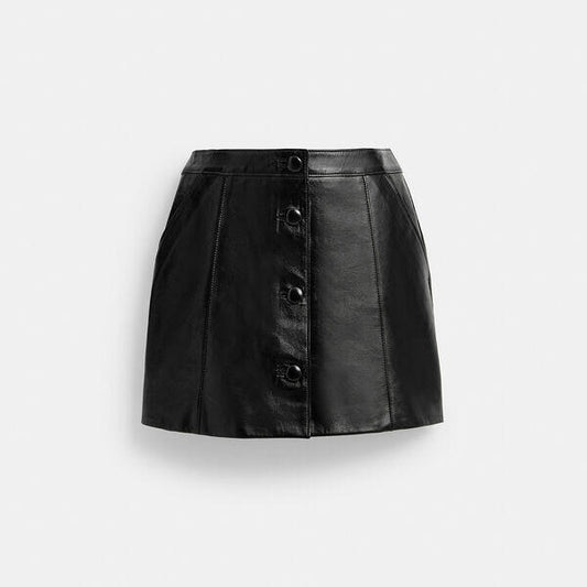 Image of a model wearing Skirts. Productname: Patent Leather Mini Skirt in BLACK colour by brand - Coach Outlet Australia
