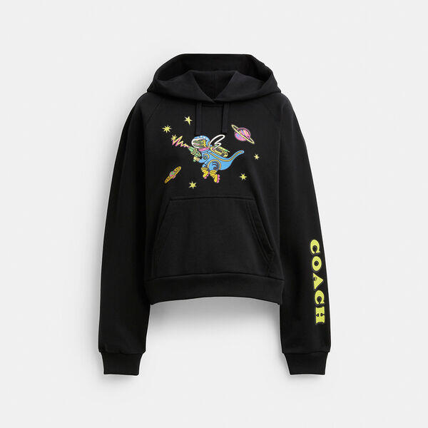 Image of a model wearing Outerwear. Productname: Cosmic Coach Rexy Print Raglan Hoodie in BLACK colour by brand - Coach Outlet Australia
