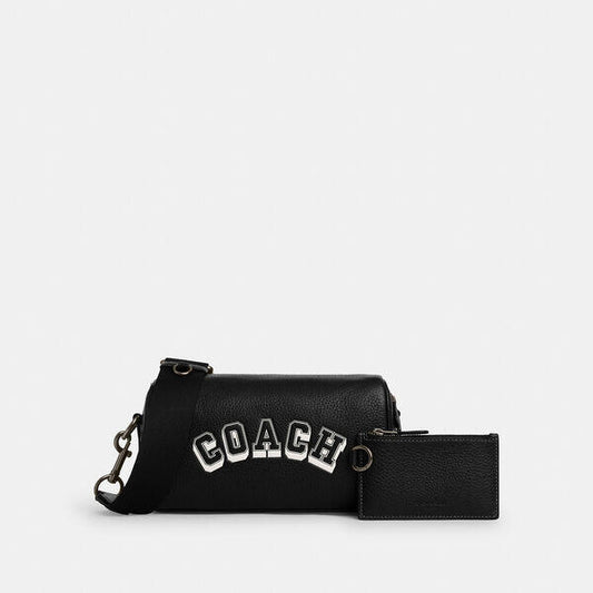 Image of Bags. Productname: Axel Crossbody Bag With Varsity Motif in BLACK/CHALK colour by brand - Coach Outlet Australia