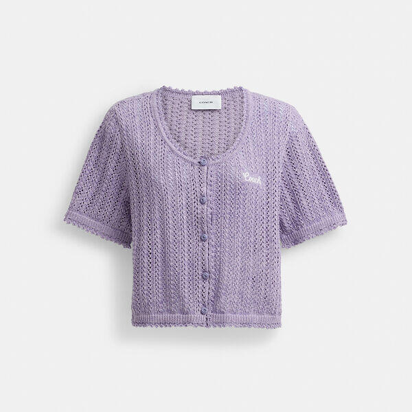 Image of a model wearing Tops. Productname: Cropped Knit Button Up Top in LILAC colour by brand - Coach Outlet Australia