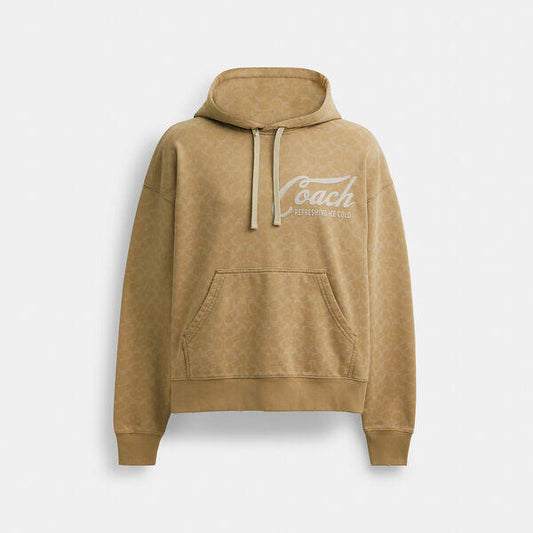 Image of a model wearing Tops. Productname: Signature Long Sleeve Relaxed Americana Pullover Hoodie in KHAKI colour by brand - Coach Outlet Australia