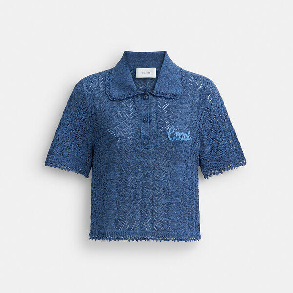 Image of a model wearing Tops. Productname: Cropped Knit Polo Top in NAVY colour by brand - Coach Outlet Australia