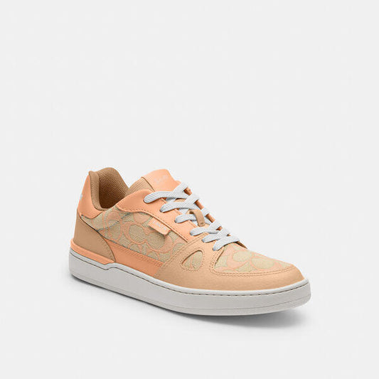 Image of Sneakers. Productname: Clip Low Top Sneaker In Signature Jacquard in FADED BLUSH colour by brand - Coach Outlet Australia