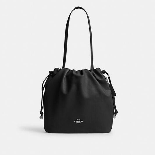 Image of a model wearing Pants. Productname: Faye Drawstring Tote Bag in SV/BLACK colour by brand - Coach Outlet Australia