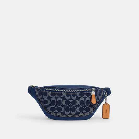 Image of a model wearing Denim. Productname: Warren Mini Belt Bag In Signature Denim in DENIM/DEEP BLUE colour by brand - Coach Outlet Australia