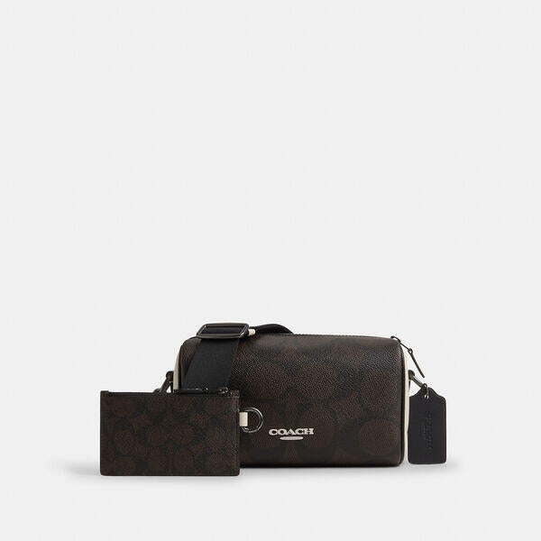 Image of Bags. Productname: Axel Crossbody Bag In Colorblock Signature Canvas in WALNUT/CHALK colour by brand - Coach Outlet Australia