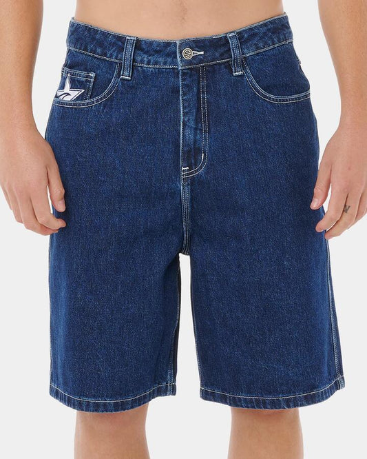 Image of a model wearing Shorts. Productname: Rip Curl Mens Medina Script Denim Shorts True Indigo - in True Indigo colour by brand - Rip Curl