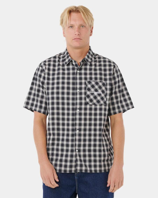 Image of a model wearing Tops. Productname: Rip Curl Mens Archive Script Plaid Short Sleeve Shirt Black - in Black colour by brand - Rip Curl