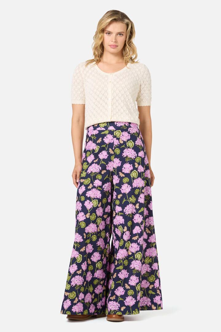 Image of a model wearing Pants. Productname: Geranium Flower Wide Leg Pant in Navy colour by brand - Princess Highway