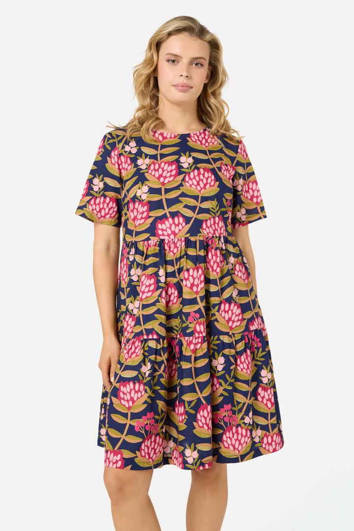 Image of a model wearing Dress. Productname: Protea Flower Smock Dress in Navy colour by brand - Princess Highway