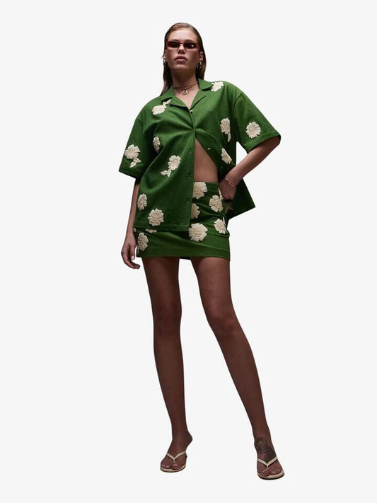 Image of a model wearing Skirts. Productname: Topshop Co-Ord Mini Skirt With Raffia Flowers in Green colour by brand - Topshop