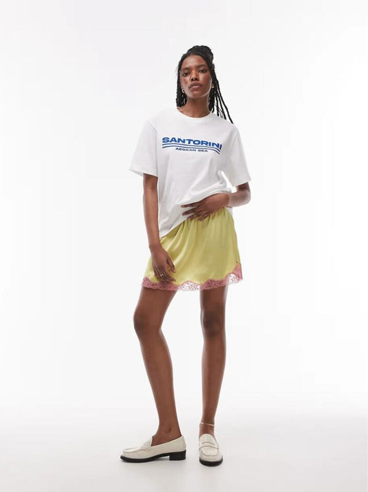 Image of a model wearing Skirts. Productname: Topshop Satin Lace Mini Skirt in Lime colour by brand - Topshop