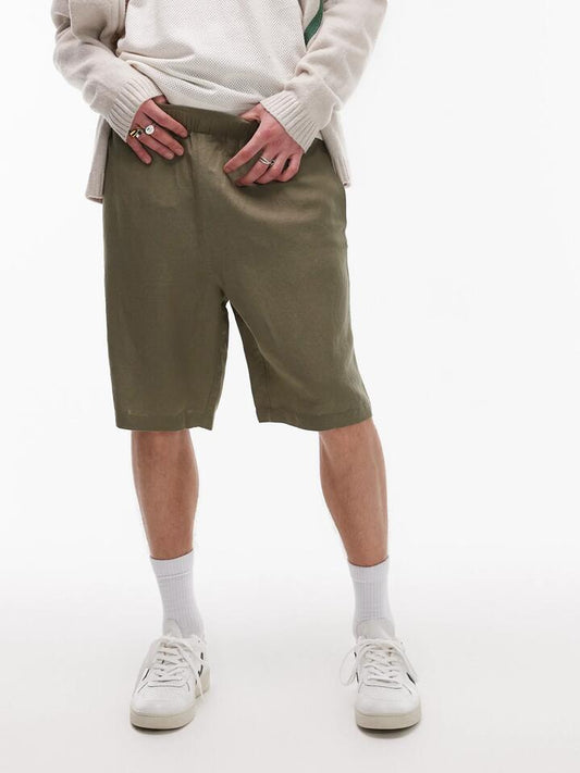 Image of a model wearing Pants. Productname: Topman Wide Leg Linen Shorts in Khaki colour by brand - Topman