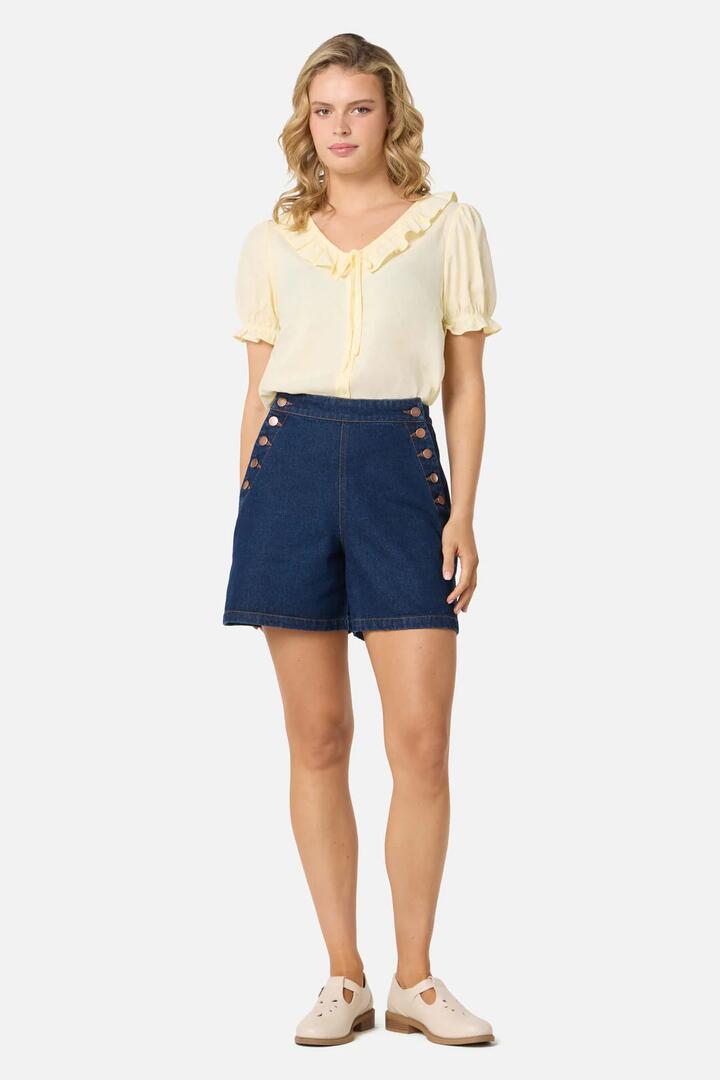 Image of a model wearing Shorts. Productname: Sailor Denim Short in Blue Denim colour by brand - Princess Highway