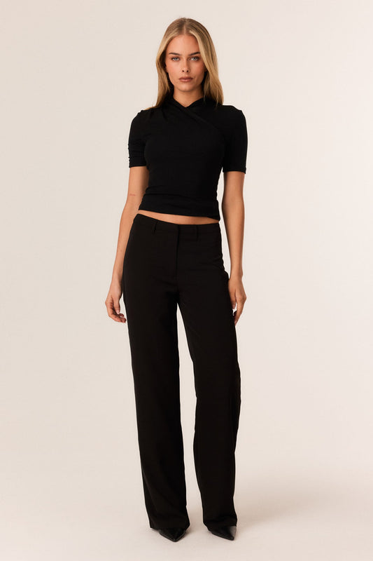 Image of a model wearing Pants. Productname: SNDYS CHASE PANTS in Black colour by brand - SNDYS