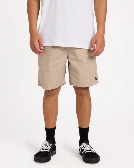 Image of a model wearing Shorts. Product name - Billabong Mens Slub Walkshorts Straw in Straw colour by brand - Billabong
