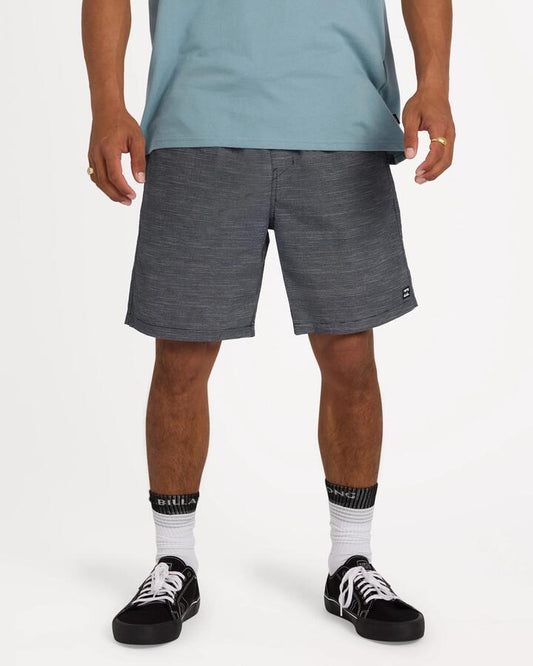 Image of a model wearing Shorts. Product name - Billabong Mens Slub Walkshorts Indigo in Indigo colour by brand - Billabong