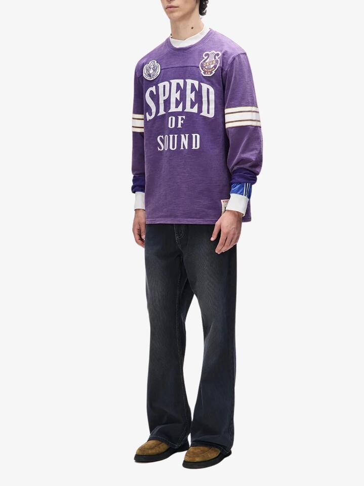 Image of a model wearing Tops. Productname: Deus Eight Track Jersey in Violet Indigo colour by brand - Deus