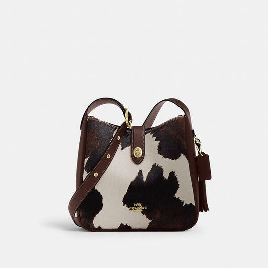 Image of Bags. Productname: Hadley Convertible Crossbody Bag With Cow Print And Tassel in IM/COW MULTI colour by brand - Coach Outlet Australia