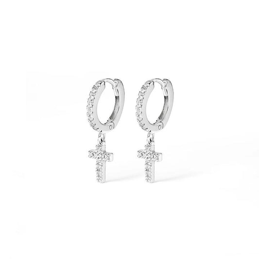 Image of Charms. Productname: Cubic Zirconia Cross Charm Huggie Earrings in Sterling Silver in Silver colour by brand - Bevilles