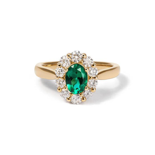 Image of Jewelry. Productname: Oval Created Sapphire Emerald Ring with 0.62tw of Laboratory-Grown Diamonds in 9kt Yellow Gold in Diamond colour by brand - Bevilles