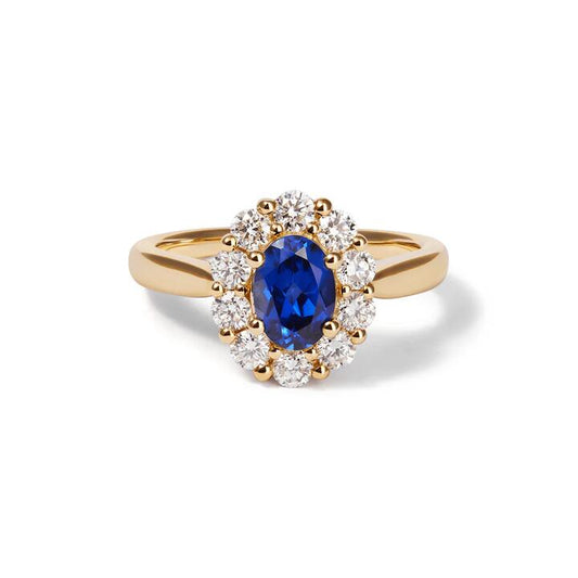 Image of Jewelry. Productname: Oval Created Sapphire Halo Ring with 0.62tw of Laboratory-Grown Diamonds in 9kt Yellow Gold in Diamond colour by brand - Bevilles