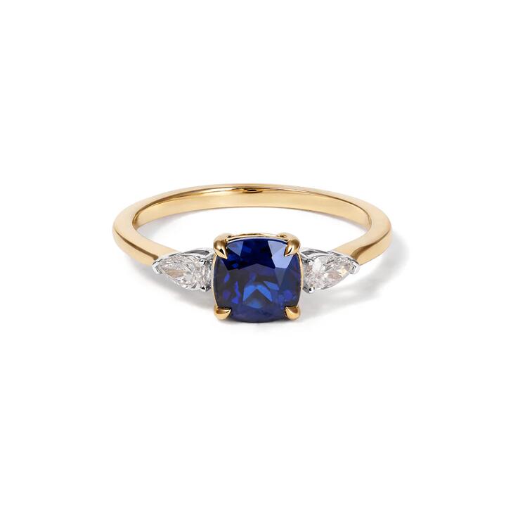 Image of Jewelry. Productname: Three Stone Ring with Created Sapphire and 0.20tw of Laboratory-Grown Diamonds in 9kt Yellow Gold in Diamond colour by brand - Bevilles