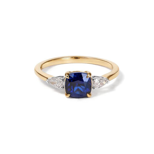 Image of Jewelry. Productname: Three Stone Ring with Created Sapphire and 0.20tw of Laboratory-Grown Diamonds in 9kt Yellow Gold in Diamond colour by brand - Bevilles