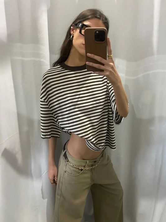 Image of a model wearing Shorts. Productname: Lioness Bloom Short Sleeve Tee in Dark Chocolate Stripe colour by brand - Lioness