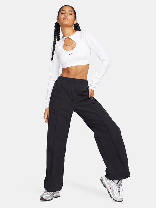 Image of a model wearing Pants. Productname: Nike NSW Mid-Rise Open-Hem Trousers in Black/White colour by brand - Nike