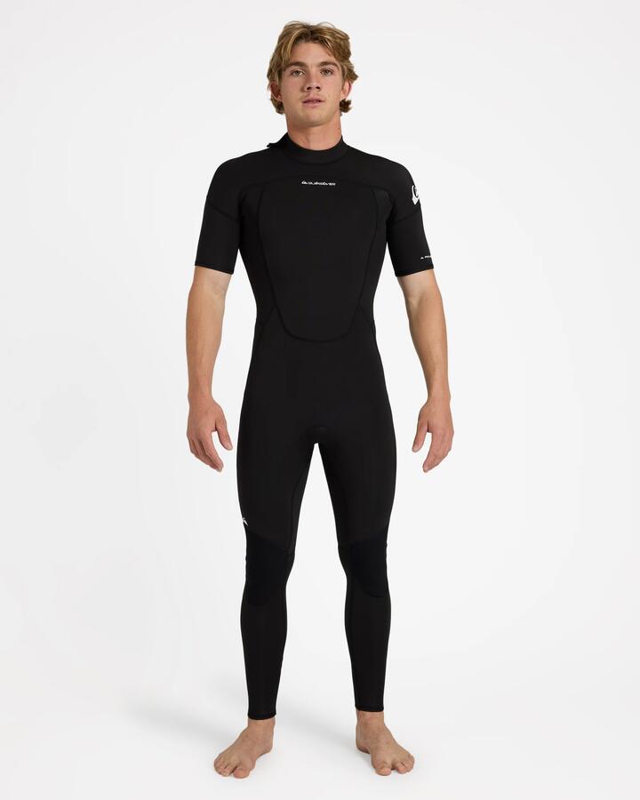 Image of a model wearing Tops. Product name - Quiksilver Mens 2/2Mm Prologue+ Short Sleeve Back Zip Wetsuit Black in Black colour by brand - Quiksilver