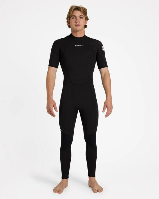 Image of a model wearing Tops. Product name - Quiksilver Mens 2/2Mm Prologue+ Short Sleeve Back Zip Wetsuit Black in Black colour by brand - Quiksilver