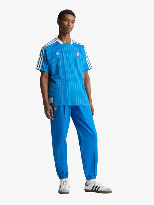 Image of a model wearing Tops. Productname: Adidas Real Madrid Icon Jersey in Blue Bird / White colour by brand - Adidas