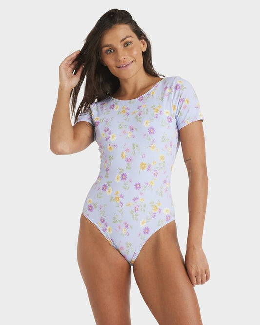 Image of a model wearing Tops. Productname: Roxy Womens Wildflower Short Sleeve One Piece Simsuit Misty Blue - in Misty Blue colour by brand - Roxy