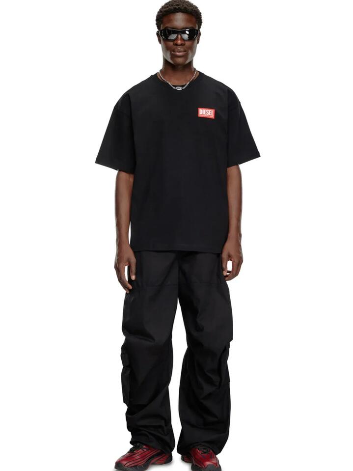 Image of a model wearing Tops. Productname: Diesel Men's T-Boxt-Lab T-Shirt in Black colour by brand - Diesel