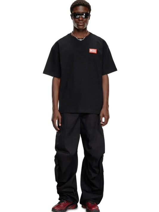 Image of a model wearing Tops. Productname: Diesel Men's T-Boxt-Lab T-Shirt in Black colour by brand - Diesel