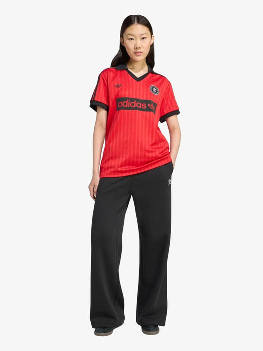 Image of a model wearing Tops. Productname: Adidas Football Tee in better scarlet colour by brand - Adidas