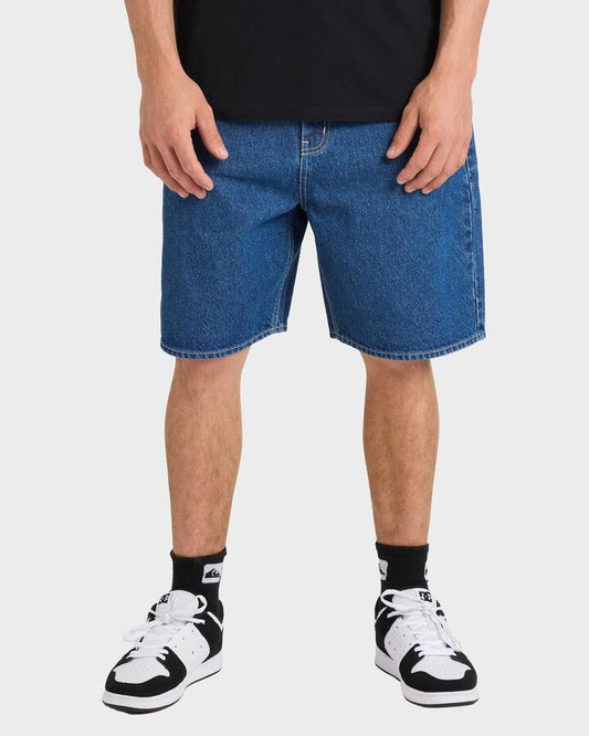 Image of a model wearing Shorts. Productname: Quiksilver Mens Impaired Baggy Denim Shorts Denim - in Denim colour by brand - Quiksilver