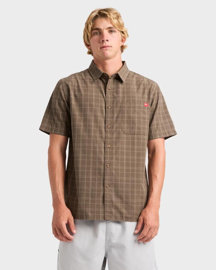 Image of a model wearing Tops. Product name - Quiksilver Mens Testament Short Sleeve Shirt Major Brown in Major Brown colour by brand - Quiksilver