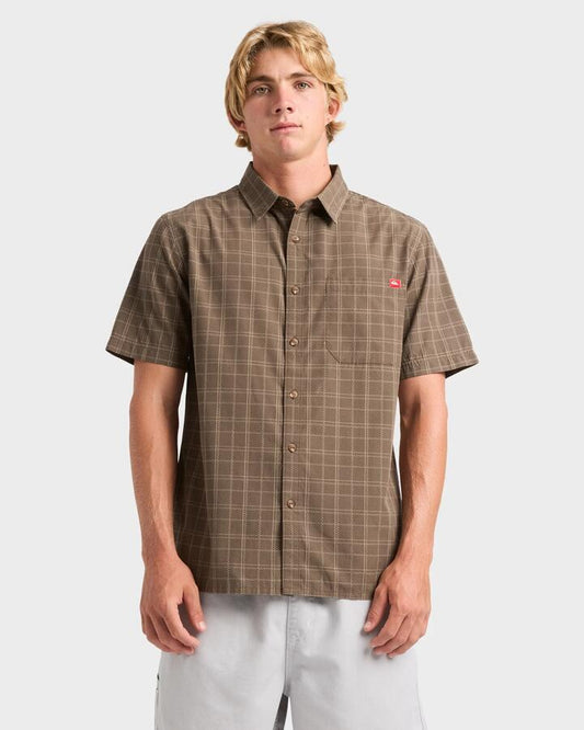 Image of a model wearing Tops. Product name - Quiksilver Mens Testament Short Sleeve Shirt Major Brown in Major Brown colour by brand - Quiksilver