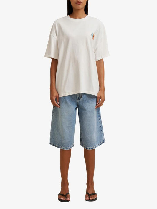 Image of a model wearing Tops. Productname: Doucette Unisex Museum Box Tee in Ivory colour by brand - Doucette