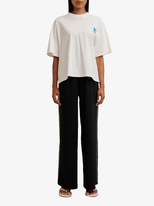 Image of a model wearing Tops. Productname: Doucette Unisex Bananas Compact Tee in Ivory colour by brand - Doucette