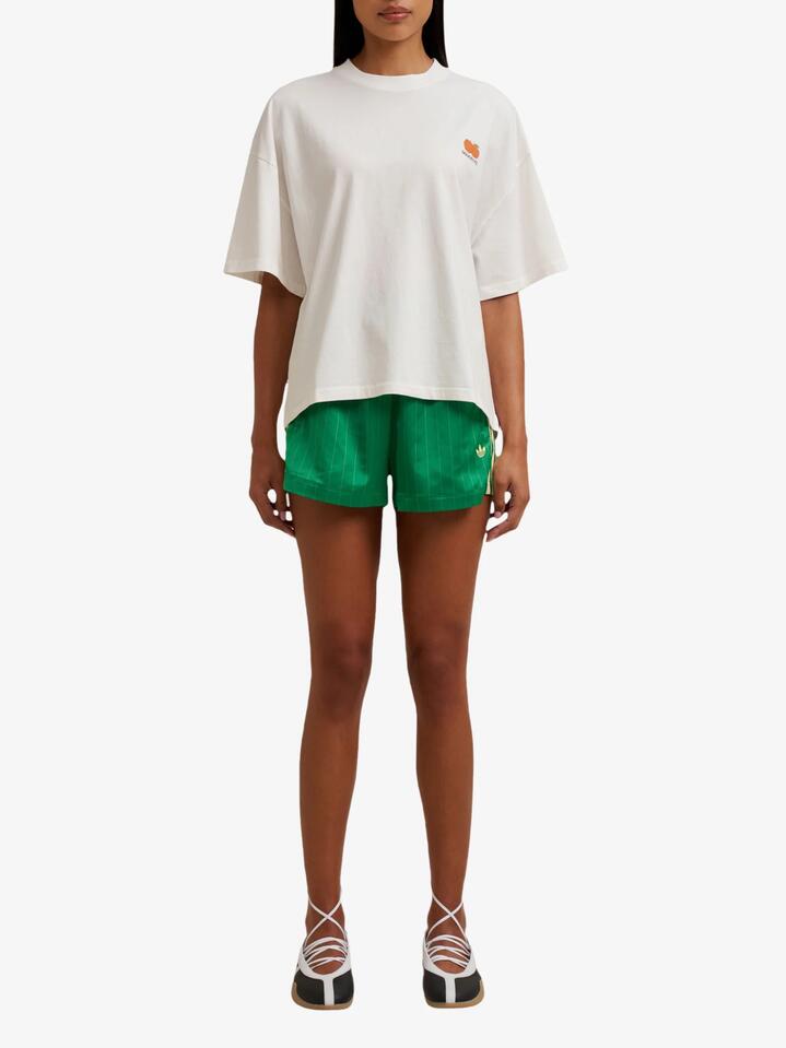 Image of a model wearing Tops. Productname: Doucette Unisex Sweet & Ripe Compact Tee in Ivory colour by brand - Doucette