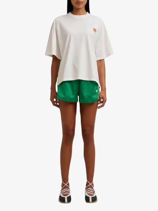 Image of a model wearing Tops. Productname: Doucette Unisex Sweet & Ripe Compact Tee in Ivory colour by brand - Doucette