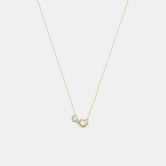 Image of Necklaces. Productname: Double Stitched Hearts Pendant Necklace in GOLD/SILVER colour by brand - Coach Outlet Australia