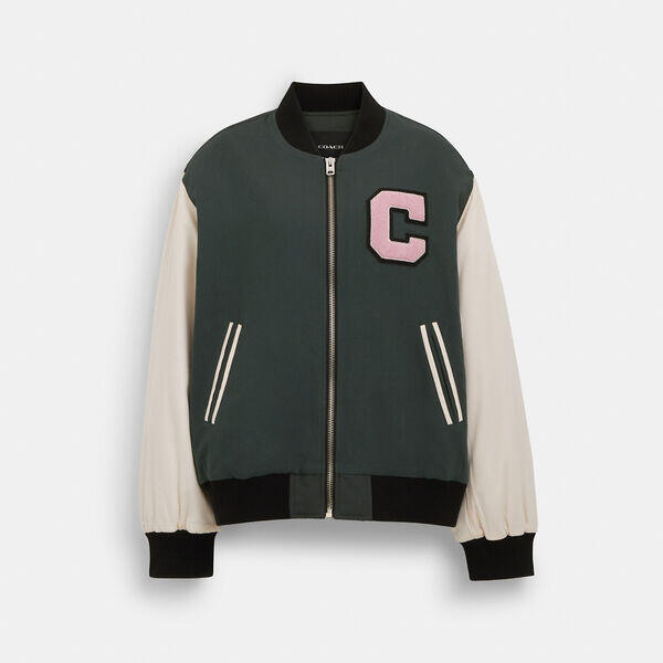 Image of a model wearing Outerwear. Productname: Coach Varsity Jacket in FOREST GREEN colour by brand - Coach Outlet Australia